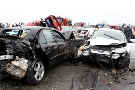 A large truck crashed into a number of cars and 4 people were killed and many were injured in a multi-vehicle collision