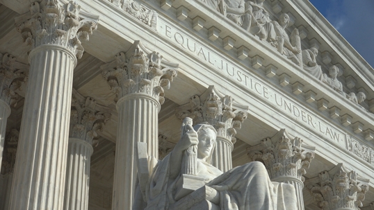 Equal Justice Under Law engraving above entrance to US Supreme Court Building.  Supreme Court faces the US Capitol Building.