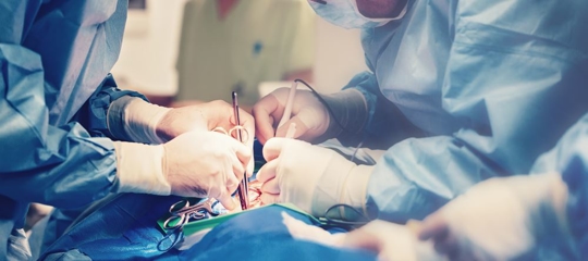 surgeons performing in operating room